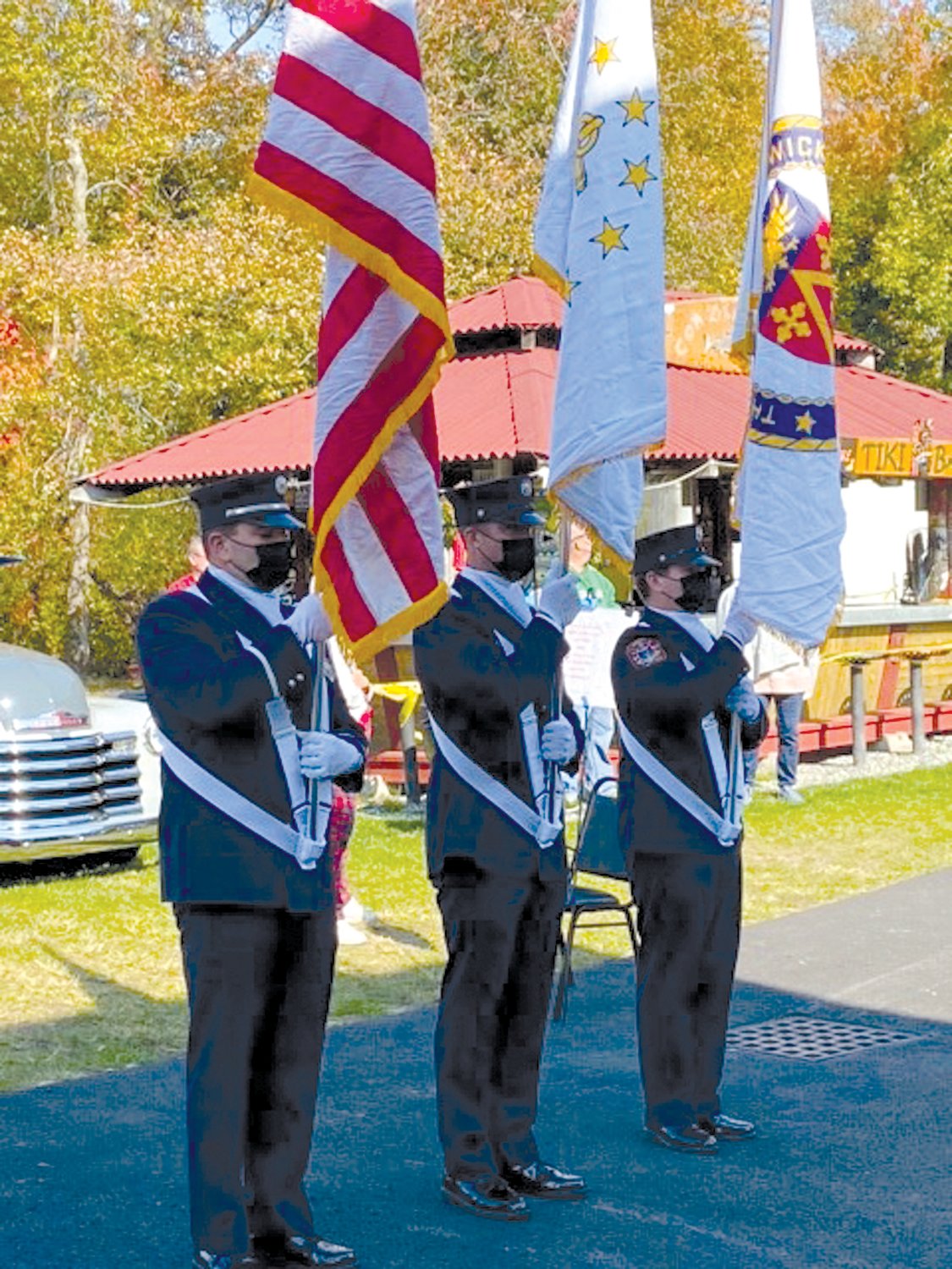 CLASSIC COLORS: A special color guard from the Warwick Fire Department that included, from left Lt. Michael Carreiro, Pvt. Ryan Jarvis and Pvt. Randall Hoxsie added what people called “an extra touch of class” to a surprise ceremony at the Elks Lodge on West Shore Road.